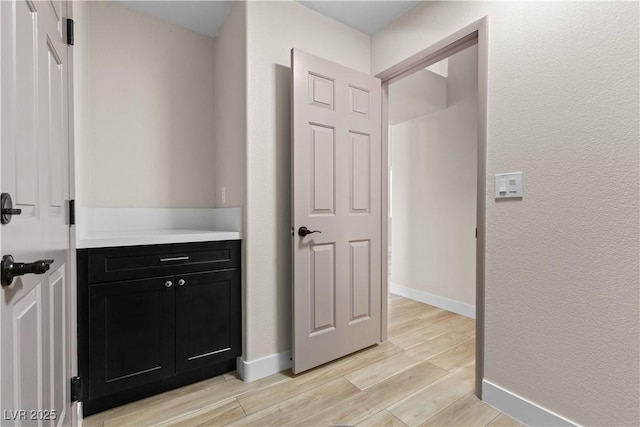 7221 W Washington Ave, Las Vegas, NV 89128 - corridor with light wood-style flooring and baseboards