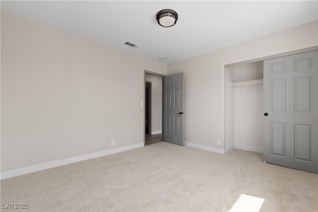 7221 W Washington Ave, Las Vegas, NV 89128 - unfurnished bedroom featuring light carpet, a closet, and baseboards