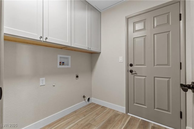 7221 W Washington Ave, Las Vegas, NV 89128 - washroom featuring hookup for an electric dryer, baseboards, cabinet space, light wood finished floors, and washer hookup