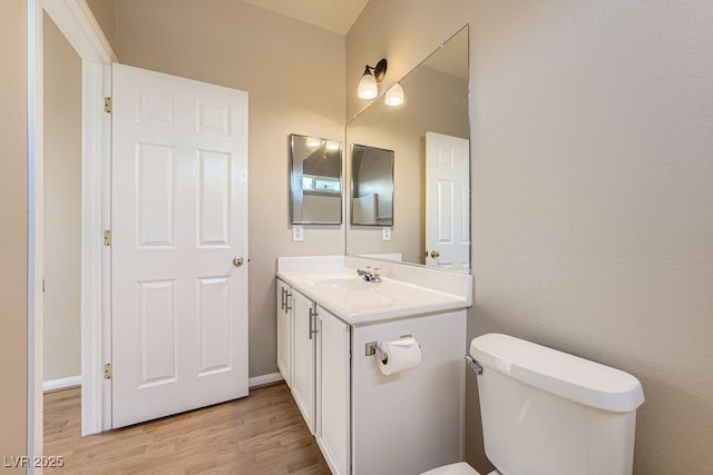 2668 Ivoryhill St, Las Vegas, NV 89135 - bathroom with wood finished floors, vanity, toilet, and baseboards