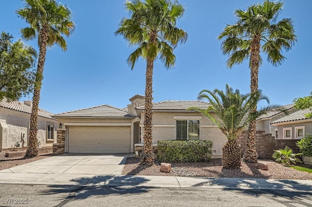 2668 Ivoryhill St, Las Vegas, NV 89135 - view of front facade with a garage, concrete driveway, stucco siding, and a tiled roof