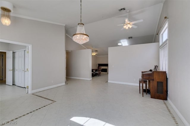 259 Baring Cross St, Henderson, NV 89074 - tiled empty room featuring a ceiling fan, high vaulted ceiling, a chandelier, baseboards, and ornamental molding