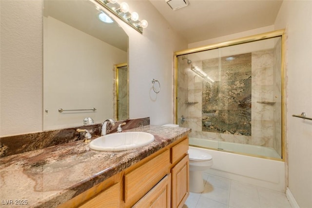 259 Baring Cross St, Henderson, NV 89074 - full bathroom featuring toilet, vanity, tile patterned floors, and bath / shower combo with glass door