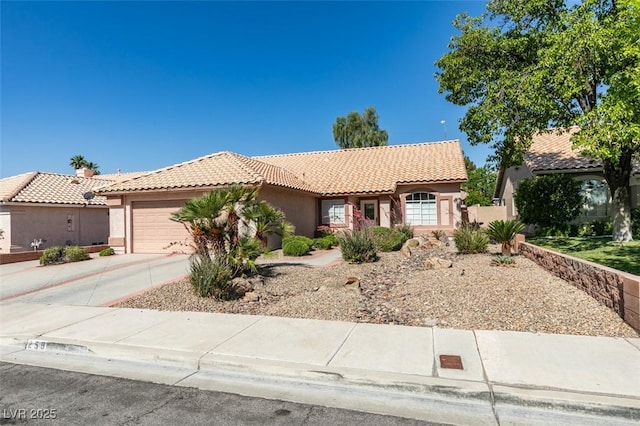259 Baring Cross St, Henderson, NV 89074 - view of front of house with stucco siding, a tiled roof, and an attached garage