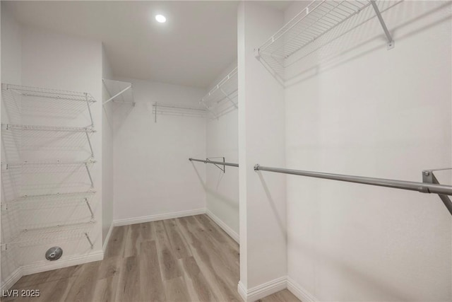 5133 Burr Oak Dr, Las Vegas, NV 89130 - spacious closet featuring wood finished floors