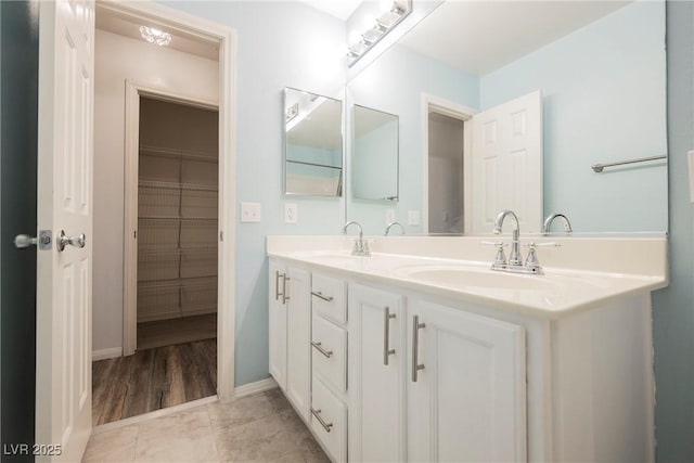 5133 Burr Oak Dr, Las Vegas, NV 89130 - full bathroom featuring double vanity, baseboards, and tile patterned floors