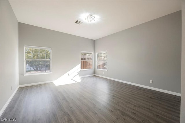 5133 Burr Oak Dr, Las Vegas, NV 89130 - unfurnished room with healthy amount of natural light, dark wood-style flooring, and baseboards