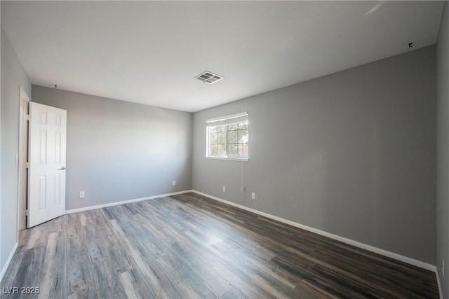 5133 Burr Oak Dr, Las Vegas, NV 89130 - empty room with dark wood finished floors and baseboards