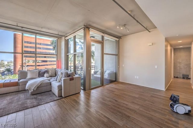 353 E Bonneville Ave Unit 379, Las Vegas, NV 89101 - living area featuring wood finished floors, a wall of windows, and plenty of natural light