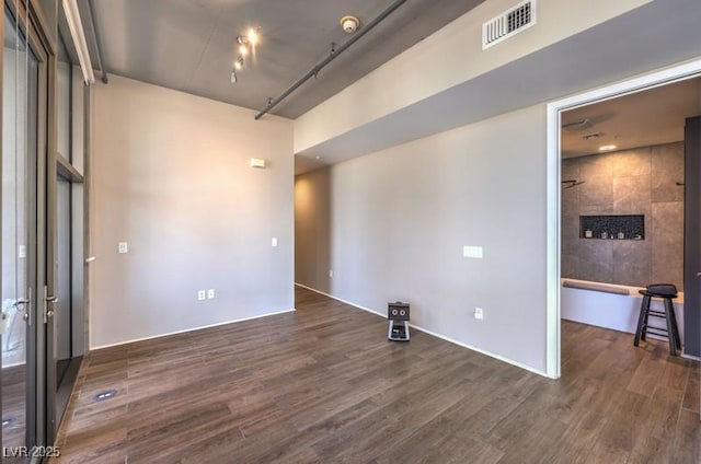 353 E Bonneville Ave Unit 379, Las Vegas, NV 89101 - empty room featuring dark wood-style flooring