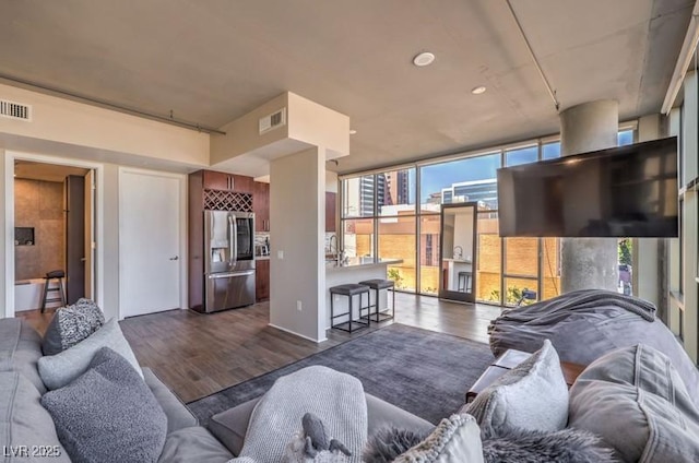 353 E Bonneville Ave Unit 379, Las Vegas, NV 89101 - living area featuring dark wood finished floors and a wall of windows