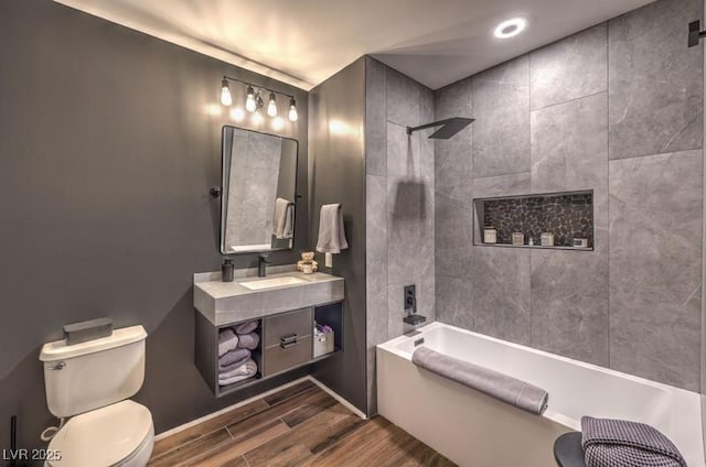 353 E Bonneville Ave Unit 379, Las Vegas, NV 89101 - bathroom with wood finished floors, toilet, shower / bath combination, and vanity