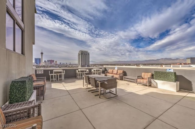 353 E Bonneville Ave Unit 379, Las Vegas, NV 89101 - view of patio / terrace featuring a view of city and a mountain view