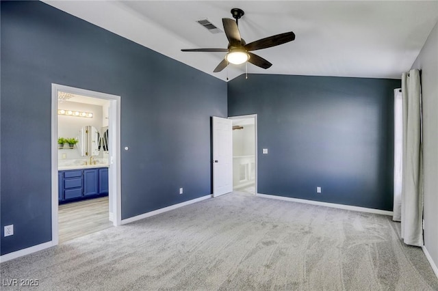 1833 Winners Cup Dr, Las Vegas, NV 89117 - unfurnished bedroom featuring carpet flooring, lofted ceiling, baseboards, ensuite bathroom, and a ceiling fan