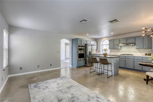1833 Winners Cup Dr, Las Vegas, NV 89117 - kitchen with appliances with stainless steel finishes, concrete floors, under cabinet range hood, baseboards, and recessed lighting