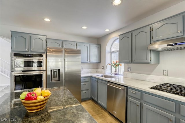 1833 Winners Cup Dr, Las Vegas, NV 89117 - kitchen featuring appliances with stainless steel finishes, gray cabinetry, recessed lighting, a sink, and under cabinet range hood
