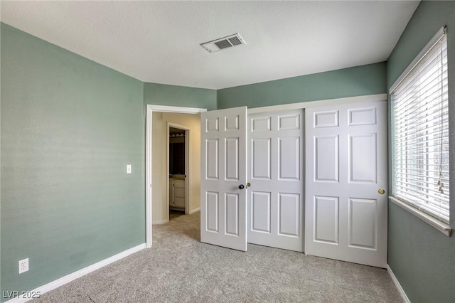1833 Winners Cup Dr, Las Vegas, NV 89117 - unfurnished bedroom featuring light carpet, multiple windows, and baseboards