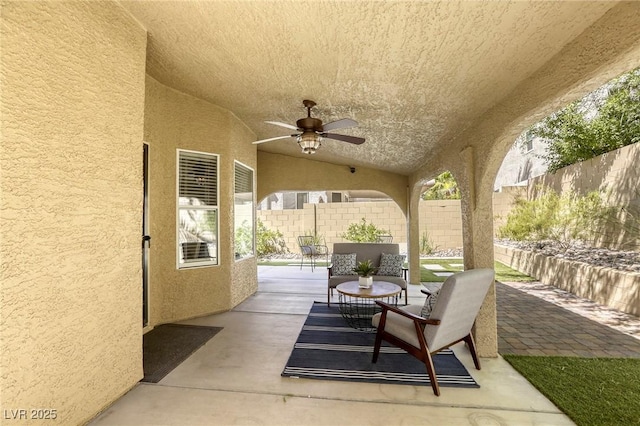 1833 Winners Cup Dr, Las Vegas, NV 89117 - fenced backyard featuring a patio, a ceiling fan, and an outdoor hangout area