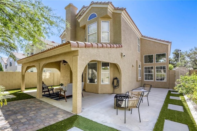 1833 Winners Cup Dr, Las Vegas, NV 89117 - rear view of house with stucco siding, a patio, and a tiled roof