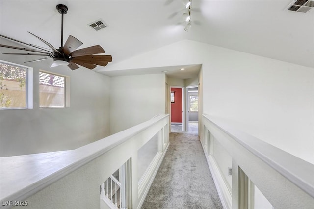 1833 Winners Cup Dr, Las Vegas, NV 89117 - corridor with lofted ceiling, light colored carpet, and track lighting