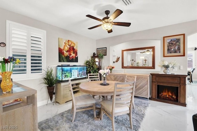 1763 Crystal Stream Ave, Henderson, NV 89012 - dining area with marble look tiles and a ceiling fan