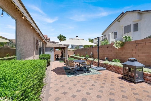 1763 Crystal Stream Ave, Henderson, NV 89012 - fenced backyard featuring a patio, outdoor dining space, and a gazebo