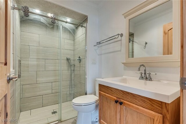 7950 Red Barn Dr, Las Vegas, NV 89123 - full bathroom featuring vanity, a stall shower, toilet, and crown molding