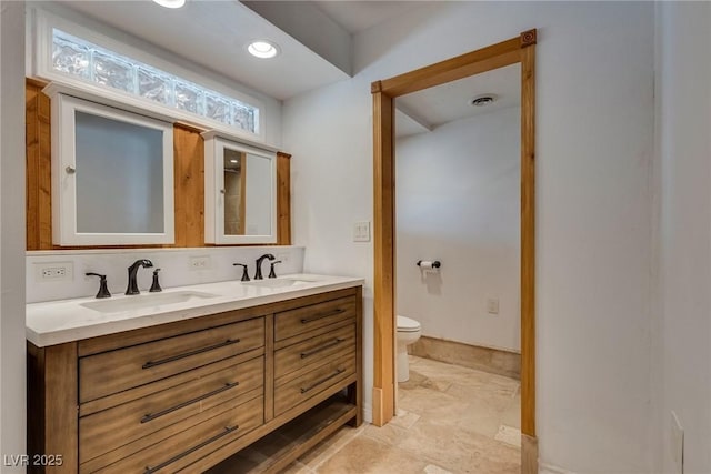 7950 Red Barn Dr, Las Vegas, NV 89123 - bathroom with double vanity, toilet, and marble finish floors
