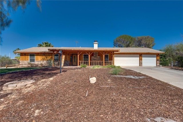 7950 Red Barn Dr, Las Vegas, NV 89123 - ranch-style house featuring an attached garage, driveway, stone siding, and a chimney