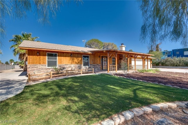 7950 Red Barn Dr, Las Vegas, NV 89123 - ranch-style home with stone siding, a chimney, a front lawn, and covered porch