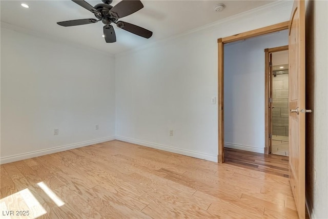 7950 Red Barn Dr, Las Vegas, NV 89123 - spare room featuring light wood-style flooring, a smoke detector, crown molding, a ceiling fan, and baseboards
