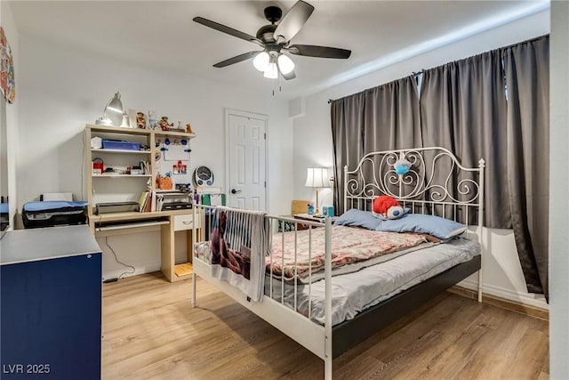 7950 Red Barn Dr, Las Vegas, NV 89123 - bedroom with wood finished floors, an office area, and a ceiling fan