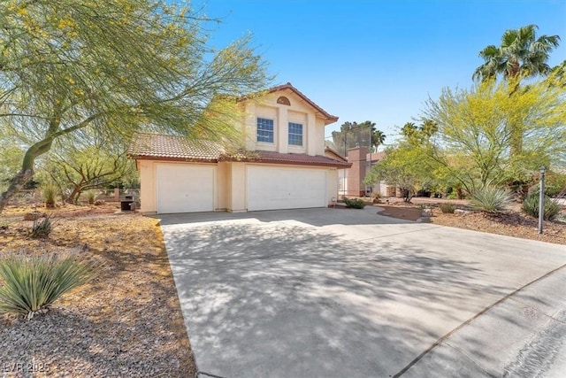 5216 Desert Star Dr, Las Vegas, NV 89130 - view of front of property with a tile roof, stucco siding, driveway, and a garage