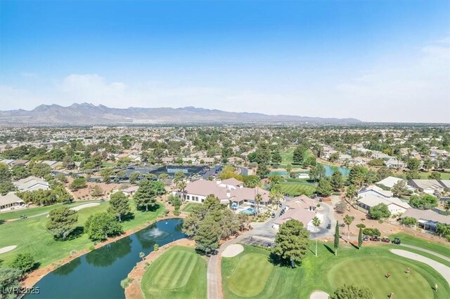 5216 Desert Star Dr, Las Vegas, NV 89130 - aerial overview of property's location featuring nearby suburban area, a golf course, and a water and mountain view