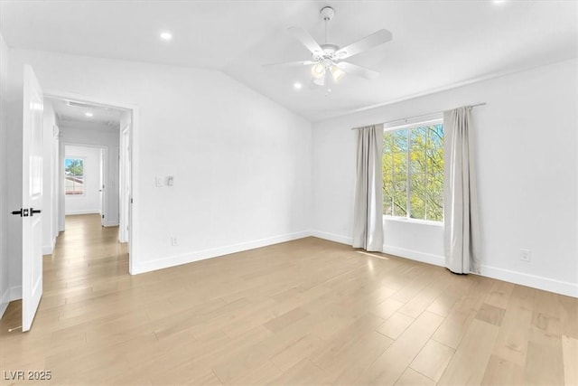 5216 Desert Star Dr, Las Vegas, NV 89130 - spare room featuring light wood-style floors, plenty of natural light, a ceiling fan, lofted ceiling, and recessed lighting