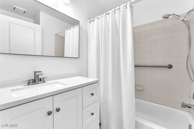 5216 Desert Star Dr, Las Vegas, NV 89130 - bathroom featuring vanity and shower / bathtub combination with curtain