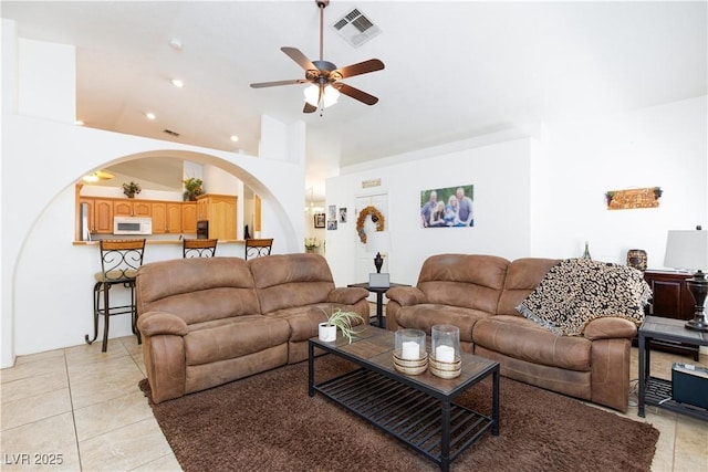 905 White Thunder St, Henderson, NV 89002 - living room featuring arched walkways, a ceiling fan, lofted ceiling, light tile patterned flooring, and recessed lighting