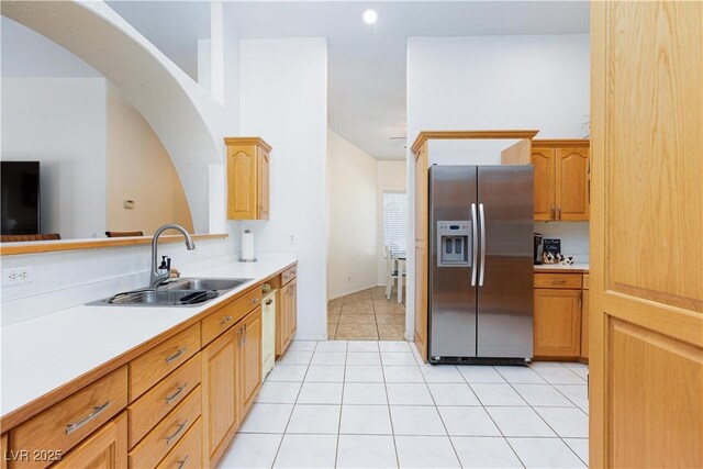 905 White Thunder St, Henderson, NV 89002 - kitchen with stainless steel fridge, a sink, light countertops, light tile patterned floors, and recessed lighting