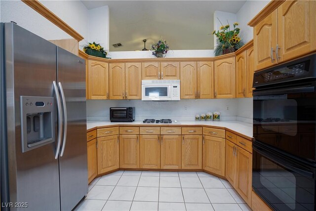 905 White Thunder St, Henderson, NV 89002 - kitchen featuring white appliances, light countertops, and light tile patterned flooring