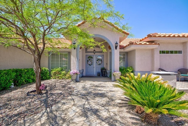 905 White Thunder St, Henderson, NV 89002 - property entrance featuring stucco siding and a tile roof