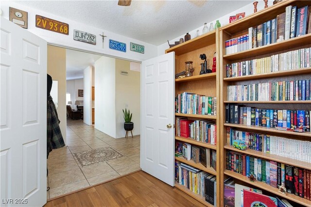 905 White Thunder St, Henderson, NV 89002 - living area with tile patterned flooring and a textured ceiling