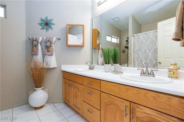 905 White Thunder St, Henderson, NV 89002 - full bathroom with double vanity, tile patterned flooring, and baseboards