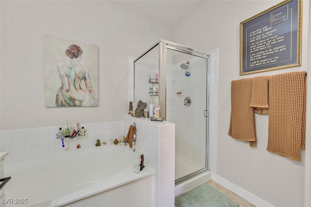 8737 Red Brook Dr Unit 201, Las Vegas, NV 89128 - full bathroom with a garden tub, a stall shower, and baseboards