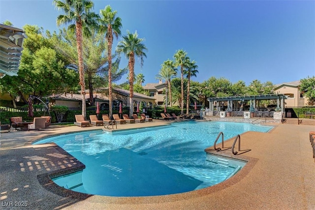 8717 Red Brook Dr Unit 201, Las Vegas, NV 89128 - community pool with a pergola and a patio area