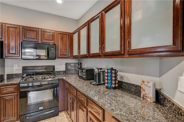 8717 Red Brook Dr Unit 201, Las Vegas, NV 89128 - kitchen featuring black appliances, glass insert cabinets, dark stone countertops, light tile patterned flooring, and recessed lighting