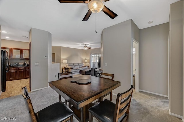 8717 Red Brook Dr Unit 201, Las Vegas, NV 89128 - dining area with a ceiling fan, light carpet, and baseboards
