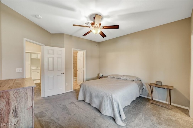 8717 Red Brook Dr Unit 201, Las Vegas, NV 89128 - carpeted bedroom featuring connected bathroom, baseboards, and ceiling fan