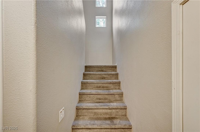 8717 Red Brook Dr Unit 201, Las Vegas, NV 89128 - stairway featuring a textured wall