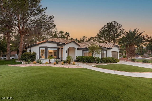 9029 Rivers Edge Dr, Las Vegas, NV 89117 - mediterranean / spanish-style home featuring stucco siding, a tile roof, driveway, and a lawn