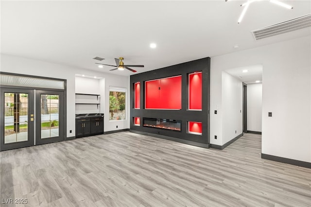 9029 Rivers Edge Dr, Las Vegas, NV 89117 - unfurnished living room with plenty of natural light, wood finished floors, ceiling fan, baseboards, and recessed lighting